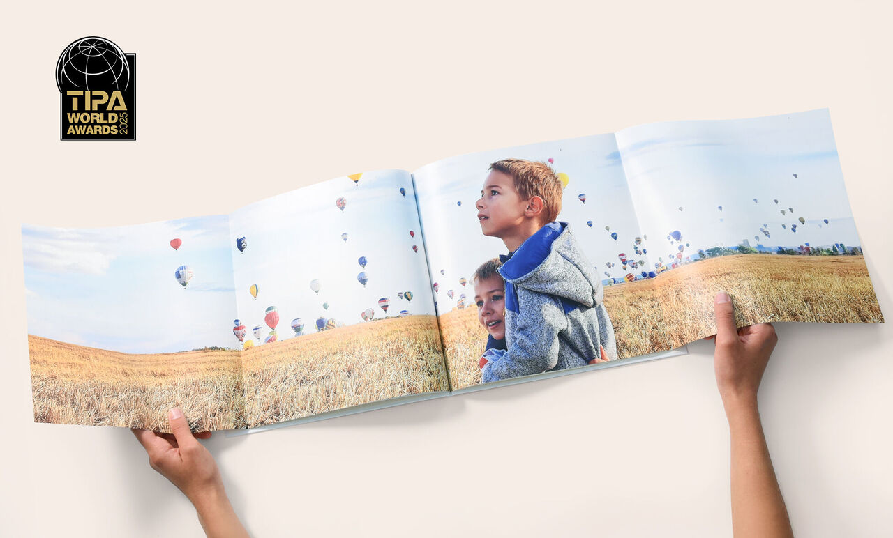 Livre Photo CEWE avec double page panoramique, élu meilleur livre photo 2025 par le jury des TIPA World Awards