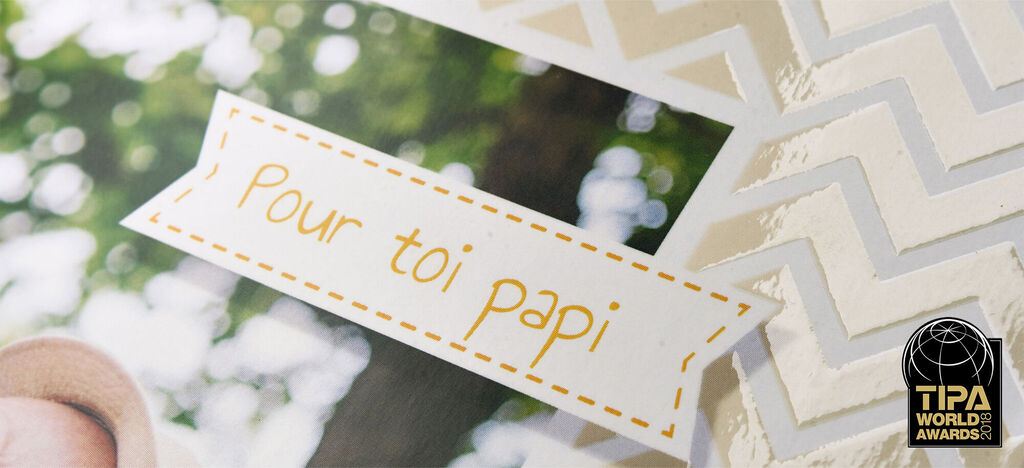 Un livre photo soigneusement conçu avec un message personnel "Pour toi papi".
