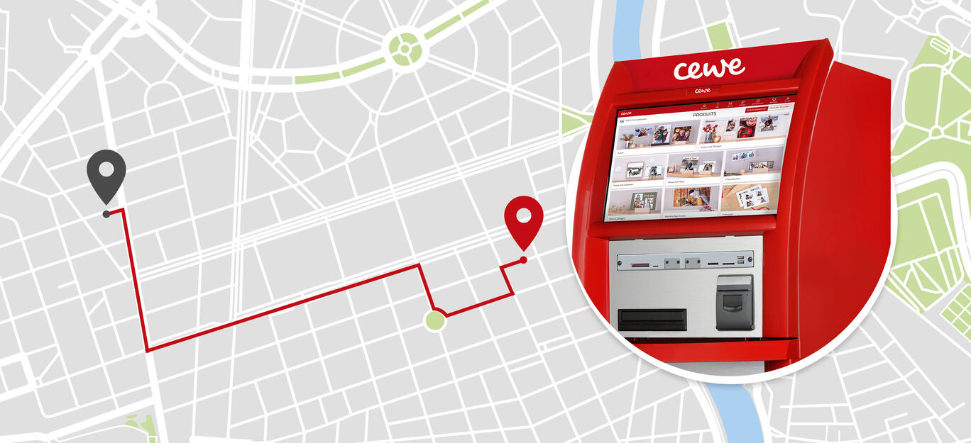 Une boîte photo CEWE sur une carte de ville montrant le chemin vers un photomaton.